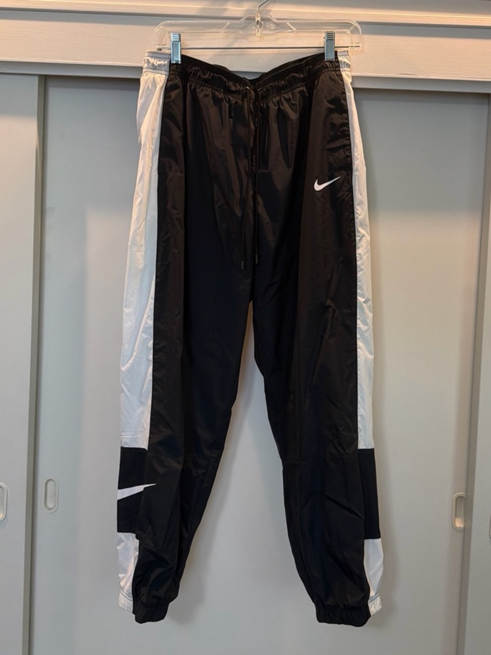 Nike Black Track Pants with White Swoosh Accents